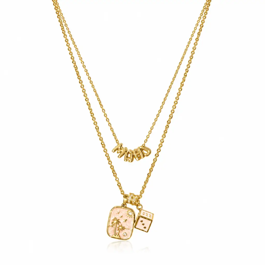 Gold layered mahjong necklace with a floral tile pendant and dice charm