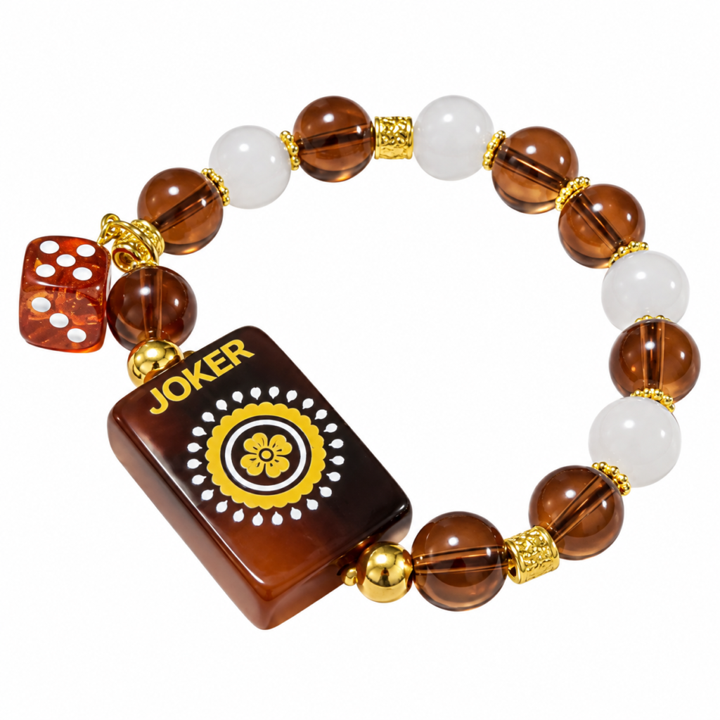 Brown and white beaded mahjong bracelet with a joker tile and red dice charm